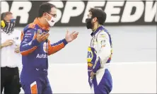  ?? Mark Humphrey / Associated Press ?? Drivers Joey Logano, left, and Chase Elliott talk following Sunday’s race at Bristol Motor Speedway in Bristol, Tenn.
