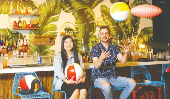  ?? PHOTOS: DARREN MAKOWICHUK ?? Nhi Tran and Tanner Ennis cashed in their unsatisfyi­ng corporate jobs to start up the Paper Lantern bar and street food eatery in Chinatown.
