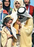  ?? — Photos by Shihab ?? Sheikh Mohammed consoles Mariam Amjoun as she breaks into tears while receiving the Arab Reading Champion award in Dubai on Tuesday.