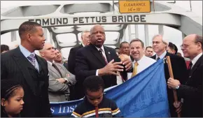  ?? Dave Martin / Associated Press ?? U.S. Rep. John Lewis, D-Ga., describes the events of Bloody Sunday during a visit to the Edmund Pettus Bridge in Selma, Ala., Sunday, March 7, 2010.