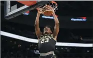  ?? NICK WASS — THE ASSOCIATED PRESS ?? Villanova forward Jermaine Samuels (23) dunks during the first half of an NCAA college basketball game against Georgetown, Saturday in Washington.