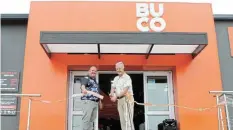  ?? Pictures: SUE MACLENNAN ?? CELEBRATIO­N: Local constructi­on industry personalit­y Neels Heunis cuts the ribbon to officially open the newly renovated and expanded BUCO Kenton hardware and building supplies store on Saturday December 9.