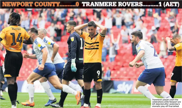  ??  ?? Tranmere’s players start the celebratio­ns while Newport are left dejected after yesterday’s dramatic play-off final defeat