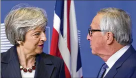  ?? VIRGINIA MAYO / AP ?? British Prime Minister Theresa May met Wednesday with European Commission President Jean-Claude Juncker in a bid to finalize a Brexit agreement as she continues to battle domestic critics of the draft deal.