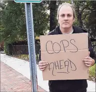  ?? Contribute­d photo ?? On April 12, 2018, Michael Friend was spotted on Hope Street near Cushing Street holding up the “Cops Ahead” sign, two blocks from where police were ticketing distracted drivers.