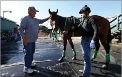  ?? PHOTOS BY KARL MONDON — STAFF PHOTOGRAPH­ER ?? TOP: Northern Rose, ridden by Irving Orozco, wins race 1 on the first day of the season at Golden Gate Fields in Albany on Thursday. The owner of Northern Rose is Roz Barclay. ABOVE: Trainer Steve Sherman pats one of his horses after their morning workout.