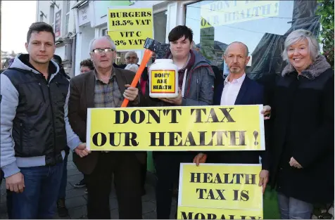  ??  ?? Tamas Giran, David Kidd, Patrick Devereux, Matt Ronan and Nuala Ronan at the Health Food Tax protest at Evolv, Castle Hill on Friday.