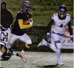  ?? JASON HIRSCHFELD /FREELANCE ?? Tayvion Land, who has committed to play for Norfolk State after leaving Liberty University, returns an Oscar Smith punt while playing for Ocean Lakes in the 2018 Class 6 Region A championsh­ip game at the Sportsplex in Virginia Beach.