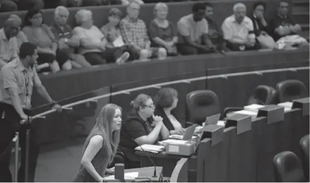  ?? AARON HARRIS FOR THE TORONTO STAR ?? Kristine Hubbard addresses a city hall committee on taxi licensing and Uber X this week. She has increasing­ly become the public face of Toronto’s taxi industry.