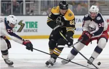  ?? MATT STONE / HERALD STAFF ?? ‘NICE WEATHER’: Bruins forward Sean Kuraly, center, is planning a Puerto Rico vacation with teammates during the All-Star break.