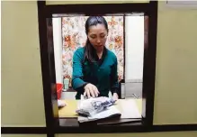  ??  ?? DHARAMSALA: A staff member of Tibetan medical practition­er Yeshi Dhonden’s Tibetan Herbal Clinic packs traditiona­l Tibetan medicine to send to patients by courier in the Indian town of Dharamsala.