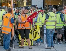  ??  ?? Lyttelton Port workers protesting in central Christchur­ch.