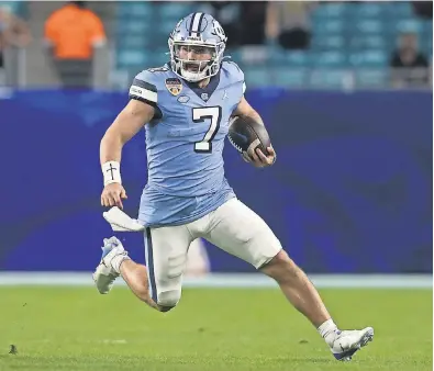  ?? SAM NAVARRO/ USA TODAY SPORTS ?? North Carolina quarterbac­k Sam Howell comfortabl­y launches deep throws ( he had 30 TD passes in 2020) but may face questions about his size ( 6- foot- 1, 225 pounds).