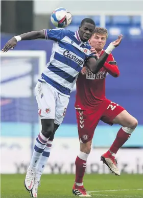  ??  ?? Bristol City’s Taylor Moore challenges Reading’s Lucas Joao for the ball
