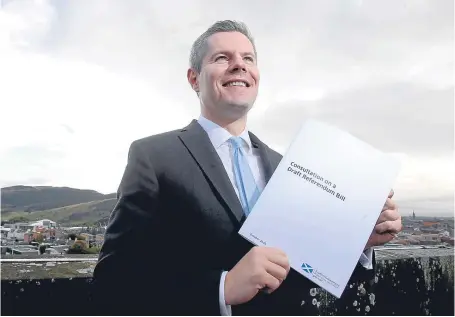  ?? Picture: PA. ?? Constituti­on Minister Derek Mackay holds a copy of the Draft Referendum Bill.