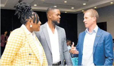  ?? ASHLEY ANGUIN/PHOTOGRAPH­ER ?? From left: Janet Silvera, chairperso­n of MoBay City Run, in conversati­on with Richard Vernon (centre), mayor of Montego Bay, and Adam Stewart, executive chairman of Sandals Resorts Internatio­nal, during the MoBay City Run Launch held at Holiday Inn Resort in Montego Bay, St James, on Wednesday.