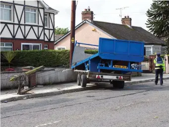  ?? Photo: Tony Gavin ?? The trailer which hit a mother and her teenager son as they walked on the footpath on Avenue Road, Dundalk, Co Louth, yesterday.