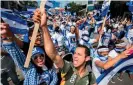  ??  ?? Nicaraguan citizens living in Costa Rica shout slogans during a protest against the Nicaraguan government inJanuary 2019. Photograph: Ezequiel Becerra/AFP via Getty Images