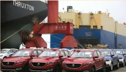  ?? (Reuters) ?? MG CARS for export wait to be loaded onto a cargo vessel on Friday at a port in Lianyungan­g, China.