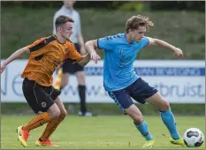  ??  ?? Dan McKenna (left) in action for Wolves.