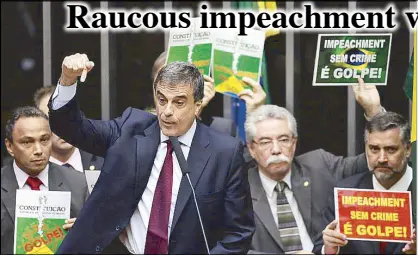  ?? AP ?? Brazil’s Attorney General Jose Eduardo Cardozo, backed by posters behind that say ‘Impeachmen­t without a crime is a coup,’ defends Brazil’s President Dilma Rousseff during a debate in Brasilia Friday.