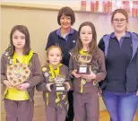  ??  ?? Award winners Teagan Luscombe, Chloe Scott and Ava Barton with Guider Sheena Fotheringh­am, left, and Jeraldine Proctor. Photos by David Phillips