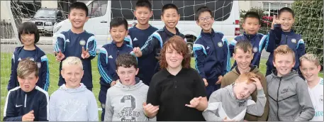  ??  ?? A game of football between local boys and a visiting soccer academy from China was part of Sunday’s celebratio­ns in Brookville.