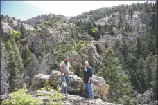  ?? J.R. LOGAN ?? Arnold Quintana, left, and Norbert Mondragon, right, with the El Salto del Agua Associatio­n, during a field trip to a restoratio­n project site this spring.