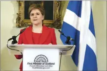  ?? Jane Barlow / Pool photo via AP ?? Nicola Sturgeon speaks during a press conference at Bute House in Edinburgh on Wednesday. Sturgeon has resigned as first minister of Scotland following months of controvers­y over a law that makes it simpler for people to change their gender on official documents. Sturgeon led the country’s devolved government and the Scottish National Party for eight years.