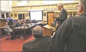  ?? NWA Democrat-Gazette/FLIP PUTTHOFF ?? Attorney Bill Watkins addresses Benton County’s Planning Board on Wednesday night regarding a proposed limestone quarry.