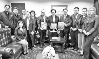  ??  ?? Christina (fifth from right) flanked by Tan (fourth from right), Rosmadi (sixth from right) and the MATTA delegation members.