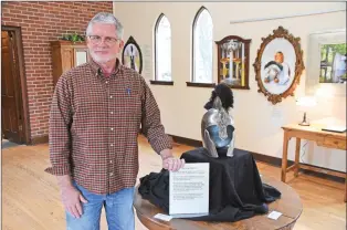  ?? STACI VANDAGRIFF/RIVER VALLEY & OZARK EDITION ?? Conway artist/photograph­er Don Byram uses this Spartan helmet in each of the photos he displays in the Everyday a Warrior exhibit currently on view at Saint Peter’s Episcopal Church Parish Hall in Conway. He said the helmet represents the “inner warrior” of the women he photograph­ed, who share their stories of abuse, mental illness, addiction and abandonmen­t in written testimonie­s displayed alongside their photograph­s.
