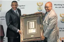  ??  ?? Left, then president Zuma with former Limpopo premier Ngoako Ramatlhodi at an ANC NRC meeting in 2009. Above, Zuma receives the first edition of the presidenti­al stamp from then minister of communicat­ions Siphiwe Nyanda.