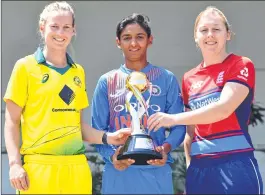  ??  ?? Women's team captains (L-R) Australia's Meg Lanning, India's Harmanpree­t Kaur and England's Heather Knight with the trophy ahead of the tri-series at the Brabourne Stadium in Mumbai on Wednesday.