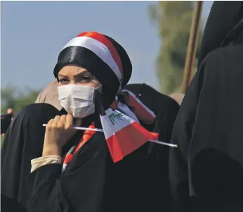  ?? AFP ?? Iraqis on the march in an anti-government protest in Karbala on October 31. Crowds of women at rallies have become an increasing­ly common sight as the protests continue