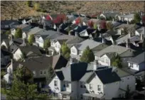  ?? JOHN LOCHER — THE ASSOCIATED PRESS ?? Homes fill a small valley in Reno, Nev. A population inrush to Nevada has been driven by people seeking more affordable housing and a growing tech industry around Reno.