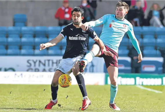  ??  ?? Sofien Moussa scored Dundee’s equaliser as they picked up a crucial point in a 1-1 draw with Hearts at Dens Park yesterday.