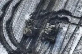  ?? UKRAINIAN ARMED FORCES VIA AP ?? In this image from earlier this month, damaged Russian tanks are seen in a field in Vuhledar, Ukraine.