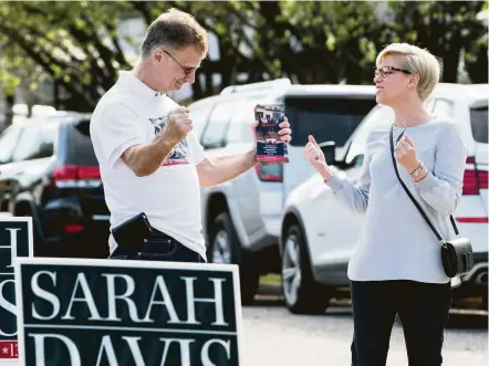  ?? Brett Coomer / Houston Chronicle ?? State Rep. Sarah Davis, R-Houston, celebrates with campaign volunteer Michael Sternesky at West University Elementary School.