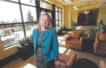  ?? David Zalubowski, The Associated Press ?? Lisa A. Goodbee, president of Goodbee & Associates Inc., gives the 17 staffers at her Greenwood Village civil engineerin­g firm six weeks at full pay and 12 at half pay for parental or caregiving leave.