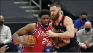  ?? CHRIS O’MEARA — THE ASSOCIATED PRESS ?? 76ers center Joel Embiid, left, works against Toronto Raptors center Aron Baynes in the first night. Even in an off shooting night Embiid posted 25points and 17rebounds.