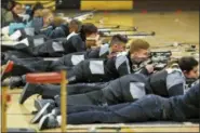  ?? MARLA BROSE — ALBUQUERQU­E JOURNAL VIA AP ?? In this photo, a group of JROTC shooters compete in the prone position during the 2018 New Mexico Junior Olympic Qualifier for sport and precision air rifles at Cibola High School in Albuquerqu­e, N.M., for the chance to compete at the National Junior...