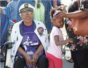  ?? TIM STEPIEN/PALM BEACH POST FILE ?? Riviera Beach resident Victoria Kingdom watches the MLK parade on Jan. 18, 2020. This Saturday marks the city’s 40th annual Celebratio­n of the Dream Parade.