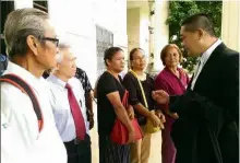  ??  ?? Comforting words: Lawyer See Chee How (right) explaining the decision to Tuai Rumah Nyutan Jami (left) and other landowners outside the courthouse.