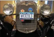  ?? PAUL POST — PPOST@DIGITALFIR­STMEDIA.COM ?? The front grill of a 1931 Ford Model A Woodie includes the license plate “NVER2OLD.”