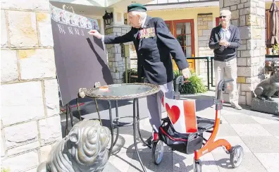  ??  ?? John Hillman marks another lap around the Carlton House retirement home on Thursday.