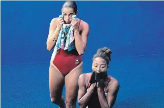  ?? CANADIAN PRESS FILE PHOTO ?? Jennifer Abel, right, and Pamela Ware qualified for the three-metre springboar­d final Thursday at the world aquatics championsh­ips. By finishing in the top 12, the pair earned a trip to the 2020 Tokyo Olympics.