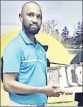  ?? (Courtesy pic) ?? Mkotoka LoL winner Musa Shongwe receiving his prize at the Mbabane Golf Club yesterday.