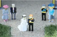  ?? — Reuters ?? A LEGO Windsor Castle replete with the upcoming wedding between Britain’s Prince Harry and Meghan Markle, is seen at Legoland, in Windsor, Britain.