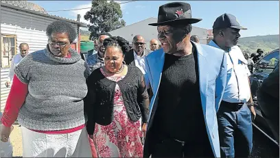  ?? Picture: SUPPLIED ?? SCENE OF THE CRIME: Police Minister Bheki Cele and safety and transport MEC Weziwe Tikana visit the Mancoba Seven Angels Church in Ngcobo on Saturday, where they were given a tour of the location by Nombongo Mancoba, mother of several of those arrested for the massacre